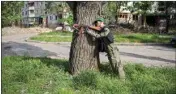  ?? ?? A mannequin dressed as a soldier is placed near a road in north Kharkiv