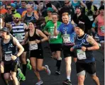  ??  ?? Runners taking part in Sunday’s KBC Dublin Marathon.