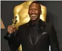  ?? The Associated Press ?? Mahershala Ali poses in the press room with the award for best actor in a supporting role for Moonlight at the Oscars Sunday at the Dolby Theatre in Los Angeles. Moonlight also won the Oscar for best picture.