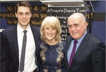  ??  ?? Retiring Deputy Principal Carol Buckley with her son Conor and husband Billy.