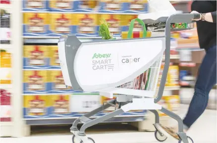  ?? CNW GROUP/SOBEYS INC. ?? Sobeys is testing a new smart cart at its Glen Abbey store in Oakville, Ont.