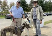  ??  ?? Norristown residents Ken Holden, left, and his brindle greyhound Bossy joined Bill Caldwell and his borzoi Segei at the Pottstown Pet Fair Saturday in Memorial Park.