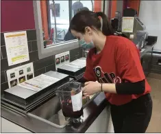  ??  ?? Hannah Caudill, an employee at Pulp Juice and Smoothie Bar in Madison Township, makes a smoothie at the business on Feb. 18. The new Pulp store, located at 2715Hubbar­d Road, opened on Jan. 26.