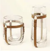  ??  ?? Saint-Louis crystal and leather vases