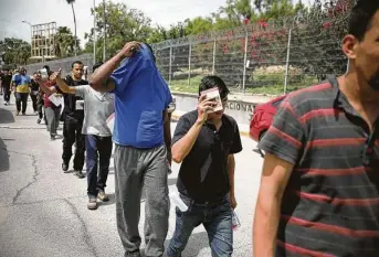  ?? Emilio Espejel / Associated Press ?? Migrants return to Mexico near the border with Brownsvill­e last summer. A federal judge on Tuesday barred the United States from enforcing a 100-day deportatio­n moratorium.