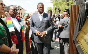  ?? - Picture: Innocent Makawa ?? President Mnangagwa reads the message on a plaque he had just unveiled, while Sports, Recreation, Arts and Culture Minister Kirsty Coventry (left) and PHD leader Prophet Walter Magaya look on during the commission­ing of The Heart Stadium in Harare yesterday.