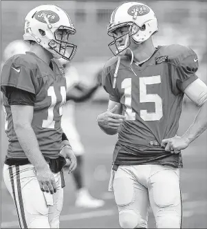  ?? AP PHOTO ?? New York Jets quarterbac­ks Sam Darnold, left, and Josh McCown talk during a practice at the NFL team’s training camp in Florham Park, N.J., on July 30.