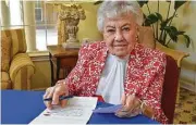  ??  ?? Parkway Place resident and retired teacher Sally York writes a card to local teachers to show her support as they begin the school year.