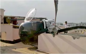  ??  ?? A helicopter on a training sortie made an emergency landing on the terrace of a fivestorey residentia­l building in Bengaluru on Thursday due to a technical snag. “There is no damage to the building. Both the pilot and trainee are safe and the...