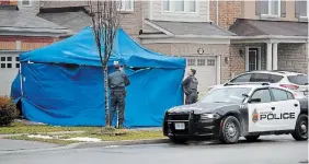  ?? BARRY GRAY THE HAMILTON SPECTATOR FILE PHOTO ?? Following the arrest, a blue tarp was visible covering a vehicle parked in a driveway on Emick Drive.