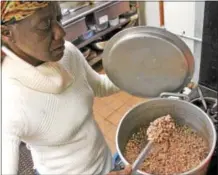  ??  ?? Kathy Sephas of Saratoga Springs stirs a pot of black-eyed peas for a community soul food meal held on Sunday evening at the Presbyteri­an New England Congregati­onal Church, part of a multifacet­ed MLK Saratoga event.