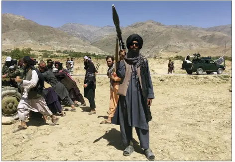  ?? MOHAMMAD ASIF KHAN — THE ASSOCIATED PRESS ?? Taliban soldiers stand guard in Panjshir province in Afghanista­n on Wednesday.