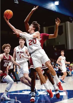  ?? Santiago Mejia/The Chronicle ?? St. Mary’s guard Aidan Mahaney, who scored 20 points, drives to the basket during the Gaels’ win over Santa Clara in Moraga on Saturday night.