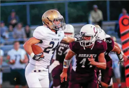  ?? BILL RUDICK — FOR DIGITAL FIRST MEDIA ?? Rustin’s Nick Benoit tries to stiff arm Oxford’s John Reninger Friday night.