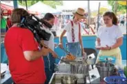  ?? SUBMITTED PHOTO — CHRISTIAN SCHEGA ?? A German film crew filmed PA Dutch food making during the 2017 Kutztown Folk Festival for their documentar­y “Palatine German Dialect in the USA.”
