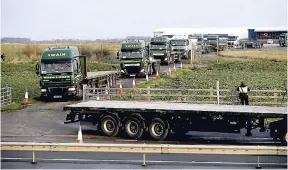  ?? AP ?? Some 150 trucks leave Manston Airfield during a ‘no-deal’ Brexit test for where 6,000 trucks could be parked at the airfield near Ramsgate in southeast England yesterday. The former airfield at Manston could be used as part of a government plan to park some 6,000 trucks to alleviate expected congestion at the channel ports, about 25 miles from the airfield, caused by the reintroduc­tion of customs checks on goods in the event of Britain making a no-deal withdrawal from the European Union at the end of March.