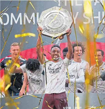  ?? Picture: Shuttersto­ck. ?? Pierre-emerick Aubameyang celebrates with his team-mates.