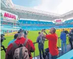  ?? DAVID J. PHILLIP/ASSOCIATED PRESS ?? Media members tour Hard Rock Stadium ahead of Sunday’s Super Bowl. The NFL has enjoyed a financial resurgence of late.