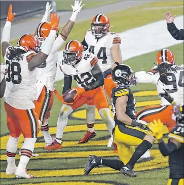  ?? CLEVELAND BROWNS Keith Srakocic Associated Press ?? strong safety Karl Joseph ( 42) celebrates after recovering a fumble in the end zone during the f irst half of their eventual NFL wild- card playoff win against the Pittsburgh Steelers.