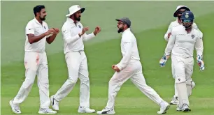  ?? AP ?? Virat Kohli celebrates India’s win with his teammates after defeating Australia by 31 runs. —