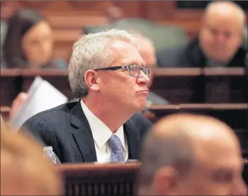  ?? E. JASON WAMBSGANS/CHICAGO TRIBUNE ?? House Republican Leader Jim Durkin listens as Gov. J.B. Pritzker delivers his first State of the State speech Jan. 29.
