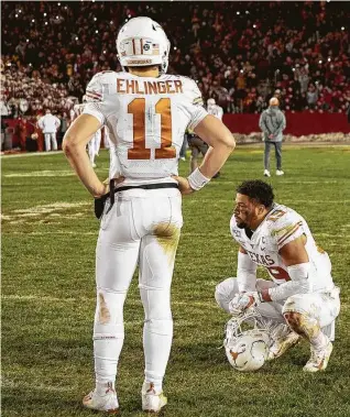  ?? NickWagner / Associated Press ?? Longhorns quarterbac­k Sam Ehlinger (11) and defensive back Brandon Jones (19) watch with disappoint­ment after Iowa State scored a game-winning field goal as time expired in 2019.