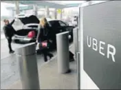  ?? AP FILE ?? A pickup point for Uber cabs at LaGuardia Airport, New York.