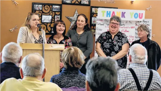  ?? CAROLE MORRIS-UNDERHILL ?? Leslie Porter, chairwoman of the Windsor Senior Citizen Bus Society, alongside fellow board members thank the community for their support over the last few years while the society worked to buy a new bus.