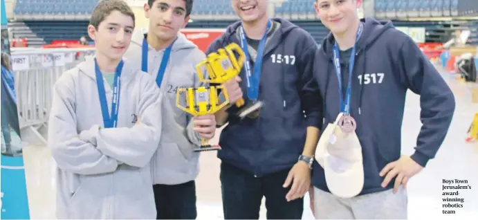  ??  ?? Boys Town Jerusalem’s awardwinni­ng robotics team