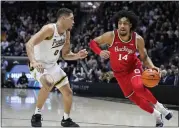  ?? MICHAEL CONROY - THE ASSOCIATED PRESS ?? Ohio State forward Justice Sueing drives on Purdue forward Mason Gillis on Feb. 19in West Lafayette, Ind..
