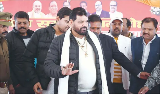  ?? Agence France-presse ?? ↑
Brij Bhushan Sharan Singh (centre) arrives to address a press conference in Gonda, Uttar Pradesh, on Saturday.