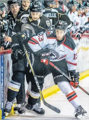  ?? CHARLOTTET­OWN ISLANDERS PHOTO/DARRELL THERIAULT ?? Lab City native Matthew Grouchy (13) struggled in the back half of the regular season after a January trade to the Quebec Remparts, but performed exceptiona­lly well in the Remparts’ QMJHL first-round playoff series against his old team, the Charlottet­own Islanders.