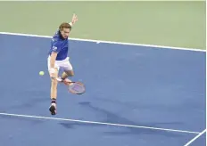  ?? — AFP ?? Nicolas Mahut of France hits a return to Yoshihito Nishioka of Japan during their Davis Cup world group first round match in Tokyo.