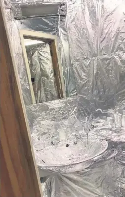  ??  ?? Scott Lewis, from Swansea, covered his friend Daniel Protheroe’s room with tin foil after he left his door unlocked while on holiday.