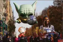  ?? Seth Wenig / Associated Press ?? Floats move down Central Park West in New York during the Macy’s Thanksgivi­ng Day Parade on Thursday.