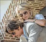  ??  ?? Tom Cruise and Sarah Wright Olsen in “American Made.”