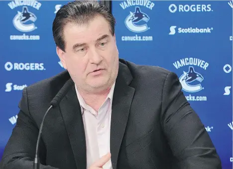  ?? NICK PROCAYLO ?? Canucks general manager Jim Benning talks to the media after receiving a contract extension on Feb. 14.