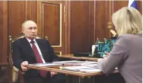  ?? (Sputnik/Kremlin/Reuters) ?? RUSSIAN PRESIDENT Vladimir Putin meets with Culture Minister Olga Lyubimova in Moscow earlier this week.