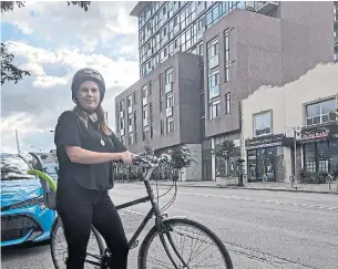  ?? JOANNA LAVOIE TORSTAR ?? Amanda O’Rourke, the executive director of 8 80 Cities, which is spearheadi­ng the pop-up, says she won’t let her children ride bikes on the Danforth in its current form because it’s too unsafe.