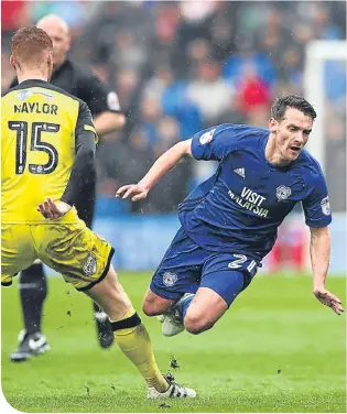  ??  ?? Craig Bryson takes a tumble, playing for Cardiff City against Burton Albion