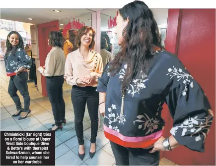  ??  ?? Chmielnick­i (far right) tries on a floral blouse at Upper West Side boutique Olive & Bette’s with therapist Schwartzma­n, whom she hired to help counsel her on her wardrobe. Brian Zak/NY Post