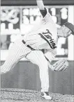  ?? BRUCE KLUCKHOHN THE ASSOCIATED PRESS ?? Minnesota Twins relief pitcher Oliver Drake throws to a Kansas City Royals batter earlier this month in Minneapoli­s. Drake has pitched for five teams this season.