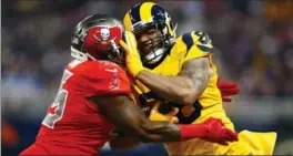  ?? ASSOCIATED PRESS FILE PHOTO ?? Rams tight end Lance Kendricks, right, collides with Tampa Bay Buccaneers linebacker Orie Lemon after catching a pass in an NFL game Thursday, Dec. 17, 2015, in St. Louis.