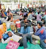  ??  ?? Passengers facing tough time due to cancellati­on of trains, following protests in the country.