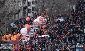  ?? Photograph: Alain Jocard/AFP/ Getty Images ?? People take part in a demonstrat­ion in Paris as part of a nationwide day of strikes and protests called by unions over a proposed pensions overhaul.