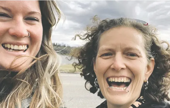  ?? CHRISTINE JOHNSTON ?? Christine Johnston, right, and Tarra Forrest take a quick break while filming a music video for Johnston's song inspired by Forrest's life story.