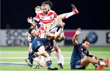  ??  ?? In this file photo taken on November 25, 2017 Japan’s fly half Yu Tamura (centre) grabs the ball next to France’s left wing Gabriel Lacroix and France’s wing Teddy Thomas (right) during the friendly rugby union internatio­nal Test match between France and Japan at The U Arena in Nanterre on the outskirts of Paris. — AFP photo