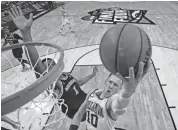  ??  ?? Villanova guard Donte DiVincenzo shoots against Michigan guard Charles Matthews in the NCAA Tournament Championsh­ip game Monday in San Antonio. JAMIE SCHWABEROW/USA TODAY SPORTS