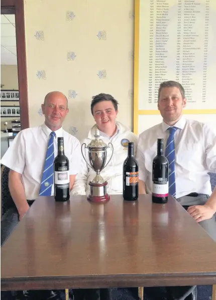  ??  ?? Bowled over Eric and Jack Donaldson then Martin Robertson of Kirkhill Bowling Club with the Sam Wilson trophy