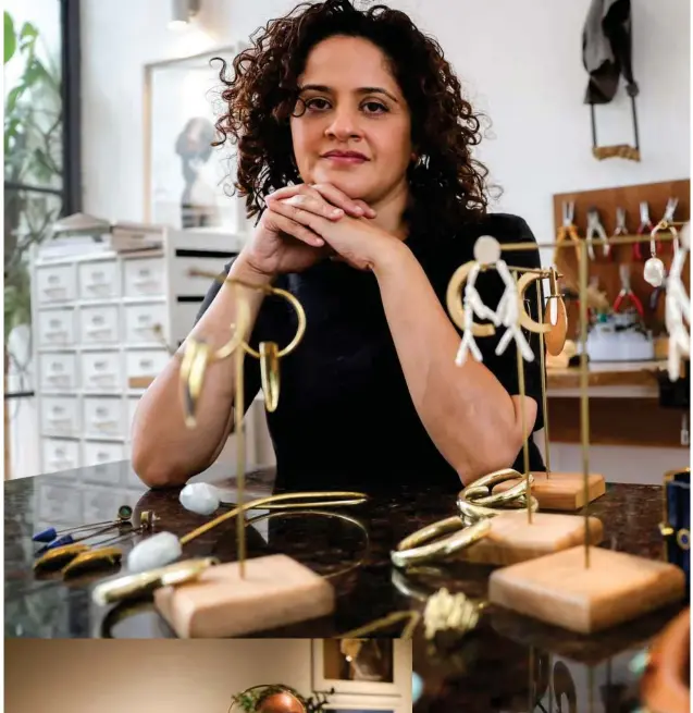 ?? ?? ↑
Kenyan designer Ami Doshi Shah with some of her eclectic jewellery pieces at her home studio.
